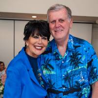 President Philomena Mantella and President Emeritus Thomas Haas standing next to each other and smiling at camera